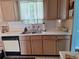 Kitchen with stainless steel sink, white countertops, and wooden cabinets at 3102 Aberdeen Cv, Lithonia, GA 30038