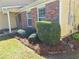 Well-maintained yard with lush greenery and manicured bushes at 3102 Aberdeen Cv, Lithonia, GA 30038