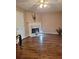 Cozy living area with a fireplace and hardwood floors at 3102 Aberdeen Cv, Lithonia, GA 30038