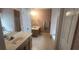 Bathroom with dual sinks, vanity, tub, and separate shower at 345 Oak Springs Nw Dr, Lawrenceville, GA 30043