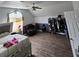 Bedroom with light grey wood flooring, ceiling fan, and a comfortable chair at 345 Oak Springs Nw Dr, Lawrenceville, GA 30043