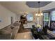 Open concept living room featuring hardwood floors, fireplace, neutral color scheme, and dining area at 345 Oak Springs Nw Dr, Lawrenceville, GA 30043