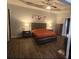 Spacious main bedroom features a tray ceiling, hardwood flooring, and an ensuite bathroom at 345 Oak Springs Nw Dr, Lawrenceville, GA 30043