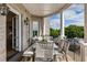 Cozy outdoor balcony, furnished with a table and chairs, perfect for relaxation and enjoying the view at 50 Canton St # 406, Alpharetta, GA 30009