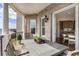 Lovely outdoor balcony, furnished with a table and chairs and with a view to the kitchen at 50 Canton St # 406, Alpharetta, GA 30009