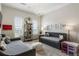 Bright bedroom with two cozy beds, shelving, and a whimsical decor at 50 Canton St # 406, Alpharetta, GA 30009