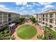 Serene courtyard featuring manicured landscaping, seating areas, and communal space at 50 Canton St # 406, Alpharetta, GA 30009