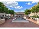 Inviting courtyard featuring a water fountain surrounded by brick patio and outdoor seating at 50 Canton St # 406, Alpharetta, GA 30009