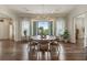 Dining room boasting an abundance of natural light, wood floors, and designer light fixtures at 50 Canton St # 406, Alpharetta, GA 30009