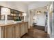 Stylish entryway with hardwood floors, decorative mirror, and ample lighting at 50 Canton St # 406, Alpharetta, GA 30009