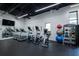 Well-lit gym featuring modern cardio machines, weights, and a sleek, spacious design at 50 Canton St # 406, Alpharetta, GA 30009