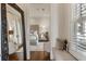 Hallway with a mirror and a window seat offering a view of the bedroom and outdoor light at 50 Canton St # 406, Alpharetta, GA 30009