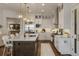 Bright, contemporary kitchen with stainless steel appliances, island seating, and white cabinetry at 50 Canton St # 406, Alpharetta, GA 30009