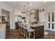 Modern kitchen with stainless steel appliances, pendant lights, a large center island, and ample cabinet space at 50 Canton St # 406, Alpharetta, GA 30009