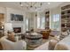 Inviting living room features a fireplace, custom shelving, and comfortable seating at 50 Canton St # 406, Alpharetta, GA 30009