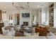 Bright living room with fireplace, comfortable seating, and open access to the kitchen at 50 Canton St # 406, Alpharetta, GA 30009