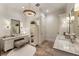 Elegant bathroom featuring dual vanities, chandelier lighting, and a separate makeup vanity area at 50 Canton St # 406, Alpharetta, GA 30009