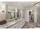 Spacious bathroom featuring dual vanities with granite countertops, and access to the walk-in closet at 50 Canton St # 406, Alpharetta, GA 30009