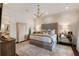 This main bedroom features a large bed, decorative chandelier, and soft, neutral-toned decor at 50 Canton St # 406, Alpharetta, GA 30009