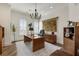 Elegant office featuring a wooden desk, herringbone floors, and a stately chandelier at 50 Canton St # 406, Alpharetta, GA 30009