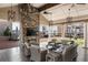 Outdoor lounge with stone fireplace, outdoor television, comfortable seating, and views of the green space at 50 Canton St # 406, Alpharetta, GA 30009