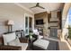 Inviting covered outdoor patio with a full kitchen, stainless steel grill, fireplace, and comfortable seating at 50 Canton St # 406, Alpharetta, GA 30009