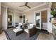 Inviting covered outdoor patio features comfortable seating, a ceiling fan, and access to the main bedroom at 50 Canton St # 406, Alpharetta, GA 30009