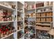 Walk-in pantry featuring organized shelving filled with food items and various kitchen supplies at 50 Canton St # 406, Alpharetta, GA 30009