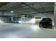 Well-lit parking garage with designated parking spaces and ample room for vehicles to maneuver at 50 Canton St # 406, Alpharetta, GA 30009
