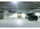 Bright parking garage features marked parking spots and easy access to storage at 50 Canton St # 406, Alpharetta, GA 30009