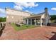 Outdoor patio features a covered sitting area, tables, umbrellas and brick pavers at 50 Canton St # 406, Alpharetta, GA 30009