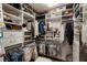 Organized walk-in closet with plentiful shelving and hanging space for clothes and accessories at 50 Canton St # 406, Alpharetta, GA 30009