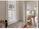 Cozy window seat with storage, natural light, and a glimpse into the bright, inviting living room at 50 Canton St # 406, Alpharetta, GA 30009