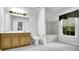 Well-lit bathroom with vanity, tub/shower, and window at 842 Laurel Crest Sw Ct, Marietta, GA 30064