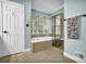 Primary bathroom features a garden tub and separate shower at 842 Laurel Crest Sw Ct, Marietta, GA 30064