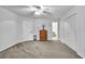 Bright bedroom boasts neutral carpet, closet, and view of bathroom at 842 Laurel Crest Sw Ct, Marietta, GA 30064
