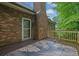 Cozy deck area with brick home exterior, stylish outdoor rug, and access to natural surroundings at 842 Laurel Crest Sw Ct, Marietta, GA 30064