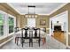Formal dining room with tile floors and a modern light fixture at 842 Laurel Crest Sw Ct, Marietta, GA 30064