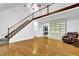 Bright and airy living room with hardwood floors and a staircase at 842 Laurel Crest Sw Ct, Marietta, GA 30064