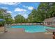 Community pool with ample seating and a well-maintained pool house in a landscaped setting at 842 Laurel Crest Sw Ct, Marietta, GA 30064