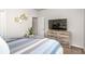 This bedroom has blue and white decor, a large TV and rustic wood furniture at 112 Leveret Rd, Locust Grove, GA 30248