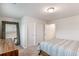 Clean bedroom with neutral carpet, full sized bed, and large mirror at 112 Leveret Rd, Locust Grove, GA 30248
