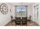 Dining room featuring a modern chandelier and outdoor views at 112 Leveret Rd, Locust Grove, GA 30248