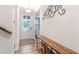 Welcoming entryway with light walls, dark wood floors, and a decorative console table at 112 Leveret Rd, Locust Grove, GA 30248