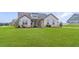 Beautiful single-story home featuring a well-maintained front yard and appealing architectural design at 112 Leveret Rd, Locust Grove, GA 30248