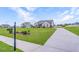 Beautiful home with a long driveway and a neatly landscaped front yard, enhancing its curb appeal at 112 Leveret Rd, Locust Grove, GA 30248