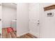 Hallway that leads into the laundry room featuring a washing machine and dryer at 112 Leveret Rd, Locust Grove, GA 30248