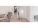 Hallway featuring neutral colored walls and plush carpeting leading to a bedroom at 112 Leveret Rd, Locust Grove, GA 30248