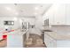 Bright kitchen with a large island, stainless steel appliances, and modern finishes at 112 Leveret Rd, Locust Grove, GA 30248