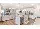 Bright kitchen with stainless steel appliances that opens to the living room at 112 Leveret Rd, Locust Grove, GA 30248